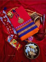 Traditional Bengali festive gift box with red saree, jewelry, bangles, flowers
