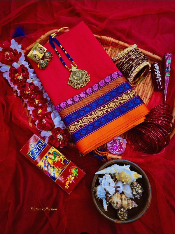 Traditional Bengali festive gift box with red saree, jewelry, bangles, flowers